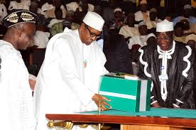 President Muhammadu Buhari laying the 2016 budget on the table